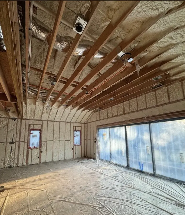 Interior walls and ceiling insulated with spray foam during new construction in Hollis
